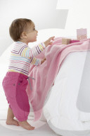 Toddler playing with wooden Blocks
