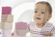Toddler playing with wooden Blocks