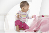 Toddler playing with wooden Blocks