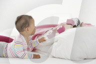 Toddler grabbing Blanket