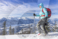 Woman hiking in snowy landscape
