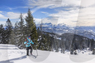 Woman hiking in snowy landscape