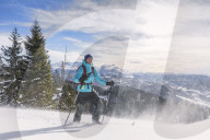 Woman hiking in snowy landscape