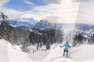 Woman hiking in snowy landscape