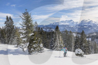 Woman hiking in snowy landscape