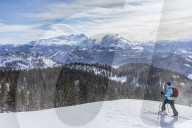 Woman hiking in snowy landscape