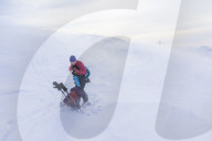 Woman hiking in snowy landscape