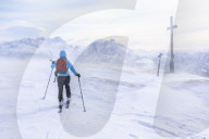 Woman hiking in snowy landscape