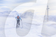 Woman hiking in snowy landscape