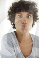 Young woman wearing a T-Shirt grimaces