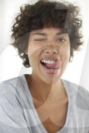 Young woman wearing a T-Shirt grimaces