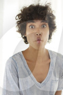 Young woman wearing a T-Shirt grimaces