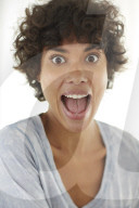 Young woman wearing a T-Shirt grimaces