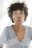 Young woman wearing a T-Shirt sticking Tongue out