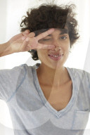 Young woman wearing a T-Shirt grimaces