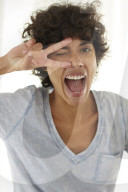 Young woman wearing a T-Shirt grimaces