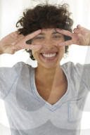 Young woman wearing a T-Shirt grimaces