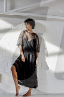 Young Woman wearing a sheer black Dress