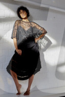 Young Woman wearing a sheer black Dress