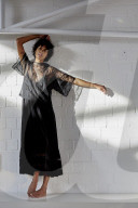 Young Woman wearing a sheer black Dress