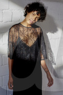 Young Woman wearing a sheer black Dress