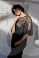 Young Woman wearing a sheer black Dress