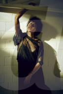 Young Woman wearing a sheer black Dress