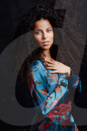 Woman wearing a blue Summer Dress with Flower and Animal Prints 