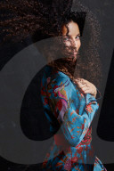 Woman wearing a blue Summer Dress with Flower and Animal Prints 