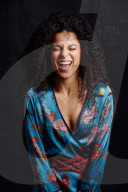 Woman wearing a blue Summer Dress with Flower and Animal Prints 