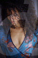 Woman wearing a blue Summer Dress with Flower and Animal Prints 