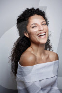 Woman wearing a white off-the-shoulder Top 