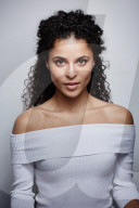 Woman wearing a white off-the-shoulder Top 