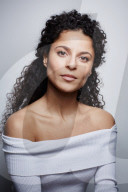 Woman wearing a white off-the-shoulder Top 