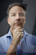 Mature Man wearing a blue Shirt  