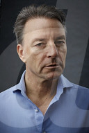 Mature Man wearing a blue Shirt  