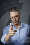 Mature Man wearing a blue Shirt  
