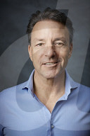 Mature Man wearing a blue Shirt  