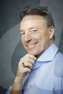 Mature Man wearing a blue Shirt  