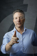 Mature Man wearing a blue Shirt  