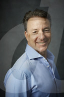Mature Man wearing a blue Shirt  