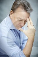Mature Man wearing a blue Shirt  