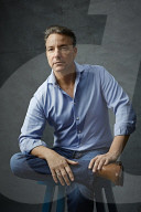 Mature Man wearing a blue Shirt  