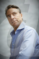 Mature Man wearing a blue Shirt  