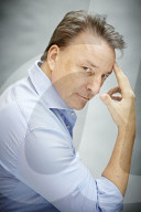 Mature Man wearing a blue Shirt  