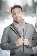Business Man wearing a grey Coat and Scarf  