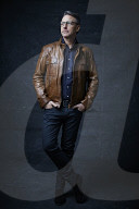 Mature Man wearing a brown Leather Jacket 