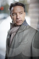 Business Man wearing a grey Coat and Scarf  
