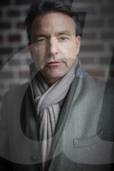 Business Man wearing a grey Coat and Scarf  