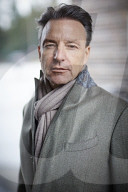 Business Man wearing a grey Coat and Scarf  